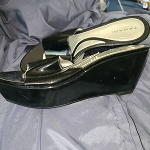 Patent leather mules.